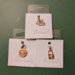 Howard's Gold Colored Charm Set with Eye, Bird, and Lock Designs
